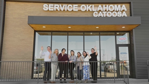 Licensed operator with team standing in front of the new Service Oklahoma Catoosa building