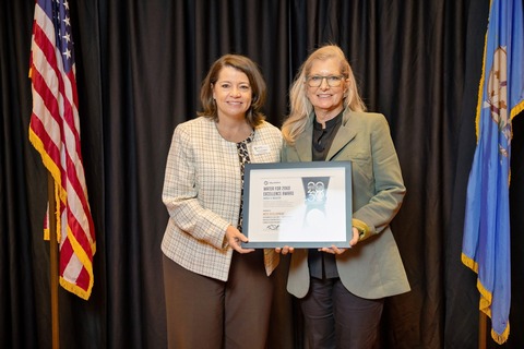 Executive Director Cunningham presenting a Water for 2060 Excellence Award