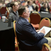 Attendee taking notes at 2024 Governor's Water Conference