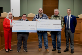 A photo of city officials and the OWRB loan analyst at the Durant City Utilities Authority check presentation