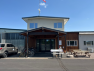 Front of Sister's Eagle Airport FBO with bikes and courtesy vehicle available