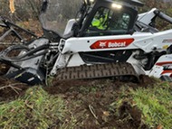 bobcat equipment in a hole