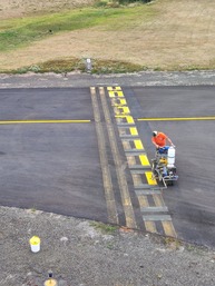staff painting the hold line
