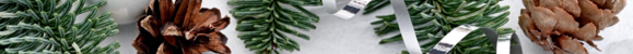 Holiday greenery with pinecones and Christmas ornaments