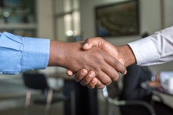 handshake by two business men