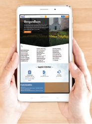 hands holding a cellphone with the screen showing the OregonBuys homepage