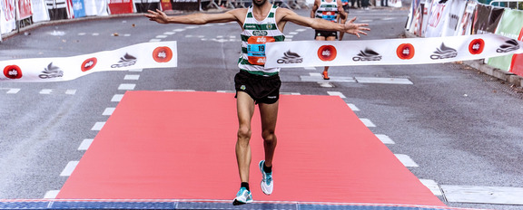 Runner crossing race finish line