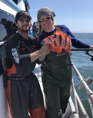 angler poses with prized tiger rockfish