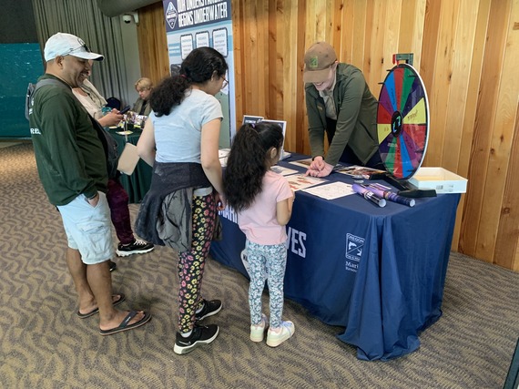 Katie Darr tabling at the Oregon Coast Aquarium for World Oceans Day. 