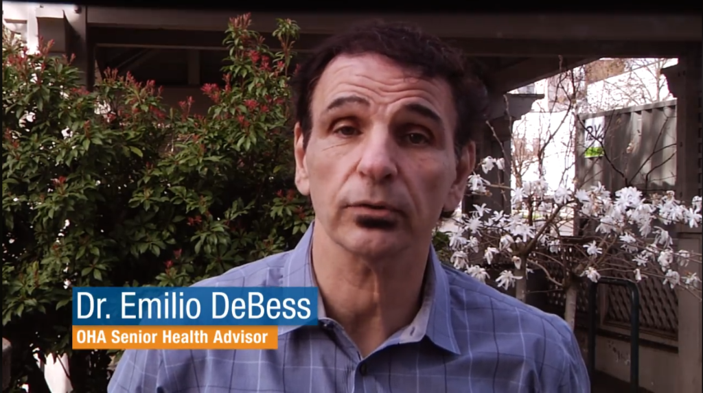 Video screenshot of Dr. Emilio DeBess, OHA Senior Health Advisor, talking. 