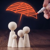 insurance concept family under umbrella