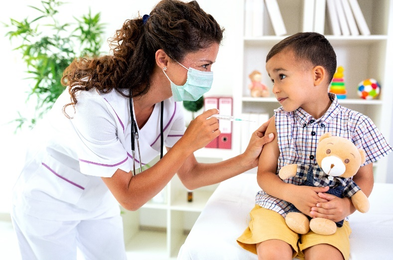 A small child receives a vaccination