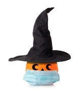 pumpkin wearing a witches hat and a surgical face mask