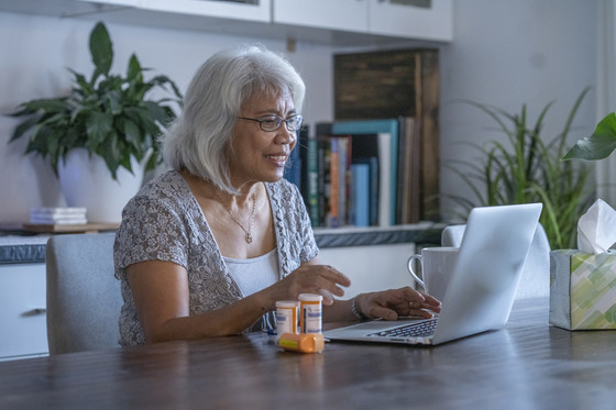 woman using computer for telehealth medicine