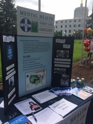 Table with posters and flyers about Mental Health First Aid