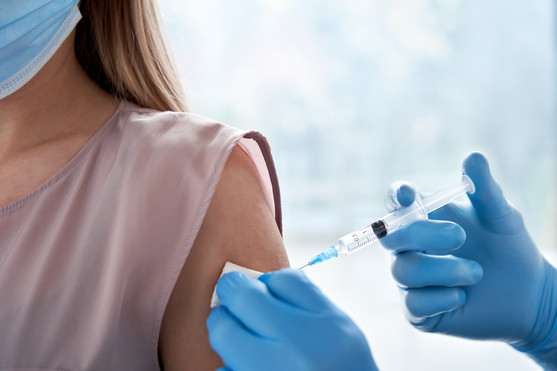 photo of someone getting a vaccination in their arm