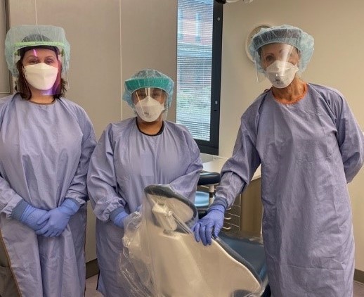 photo of three dental assistants in uniform