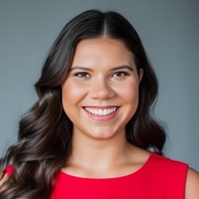 Rochelle Perez smiling woman in red dress with brown hair VR Service Equity Manager