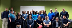 photo of a group of people all wearing blue in an ODHS office