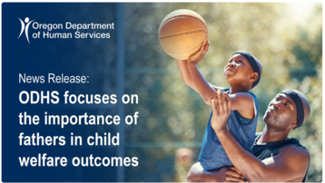 Black man holding young black boy with basketball smiling