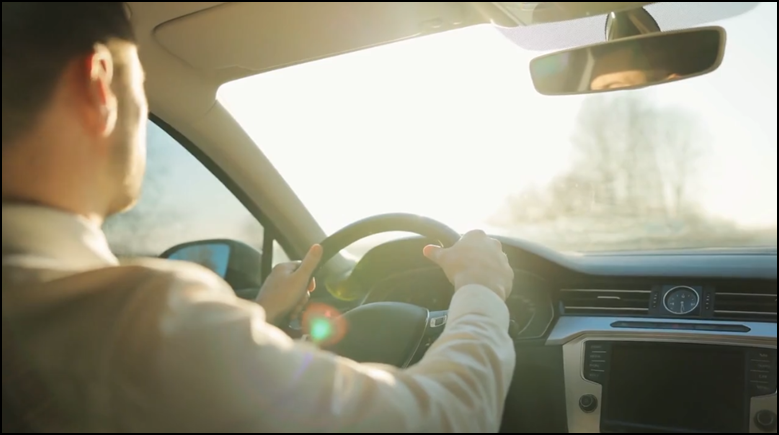 Person Driving a car on a sunny day