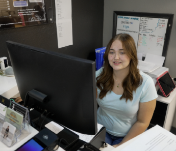 teen girl in front of computer