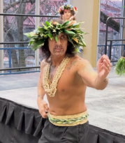 Jack Jackman wears traditional Pacific Islander dance clothing and performs at a Winterhawks game