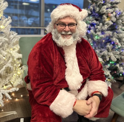 ODHS employee Todd Wels plays Santa at an event for kids in foster care