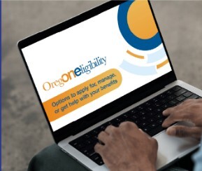 person typing on computer with ONE on screen