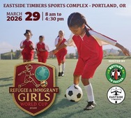 girl kicking a soccer ball