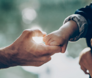 Parent holding hands with child