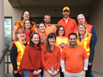 Coworkers dressed in orange