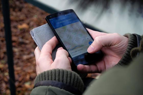 A smartphone can help plan your public transit trips.