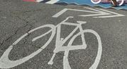 Bike sign on pavement