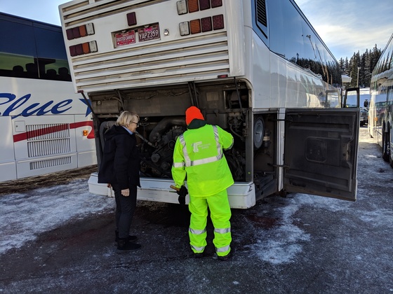ODOT Commercial Motor Vehicle Inspector Michael Emanuel (right) shows a driver some of the equipment he checks out during an inspection.