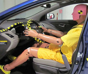 Crash test dummy in vehicle