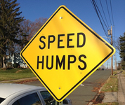 Traffic Humps yellow roadway sign
