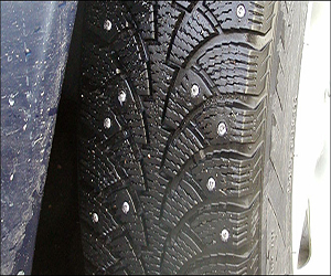 Studded tire on pavement