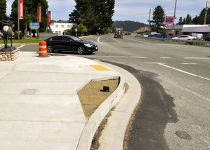 A curb extension protrudes into the parking lane. It lessens the distance someone has to cross and increase visibility.
