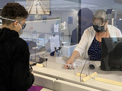 DMV serving customers with masks