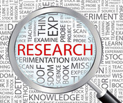 Magnifying glass with the word "research"
