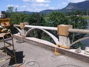 Repairing damaged guardrail on historic highway.