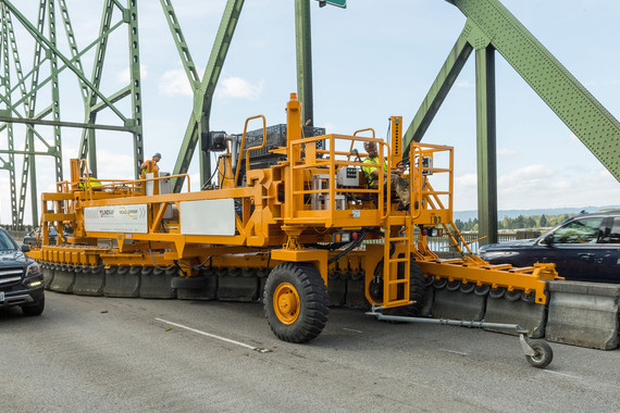 The zipper truck moves along Interstate Bridge, shifting barrier.