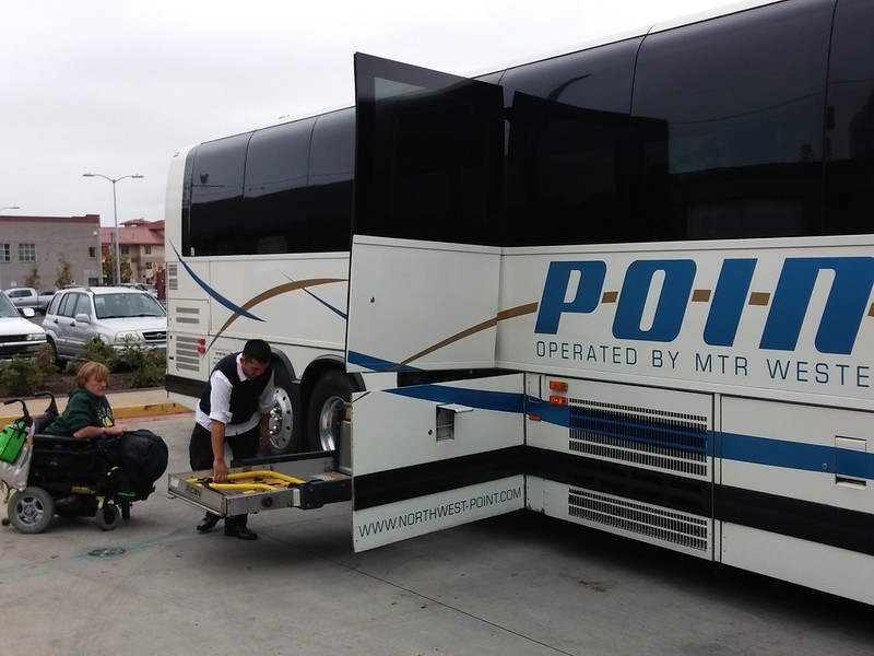 Wheelchair user boarding bus