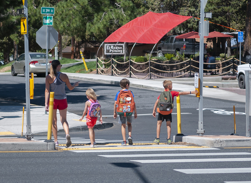 Children at crosswalk walking safely