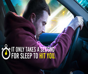 Text: It only takes a second for sleep to hit you. Image: Man nodding off behind the wheel of vehicle.