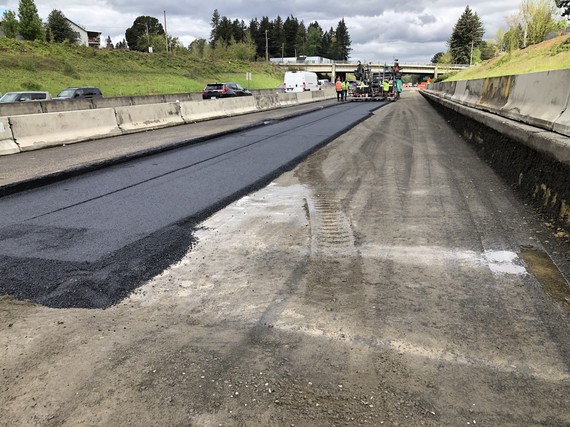 Crews paving a section of the road.