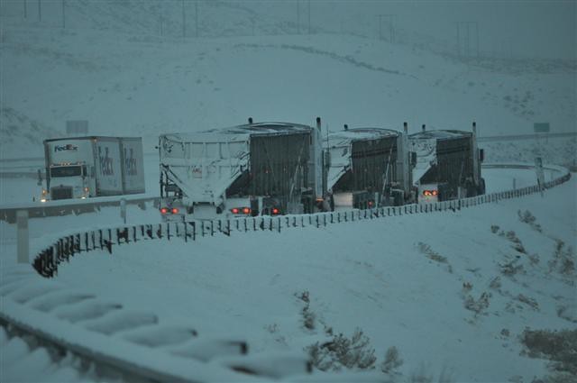 Trucks in snow on I-84