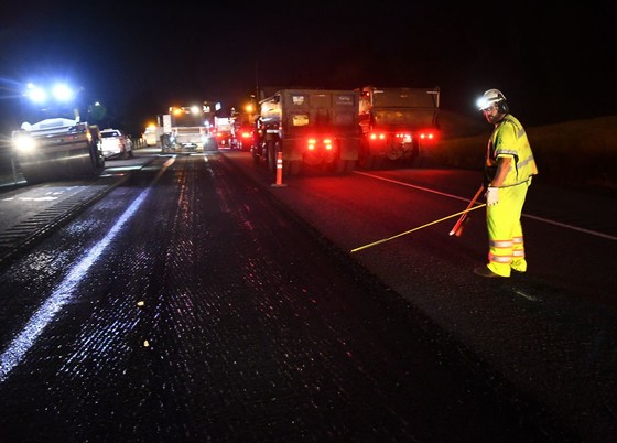 A Knife River Materials employee works a detoured section of Interstate 5 in Medford in 2020