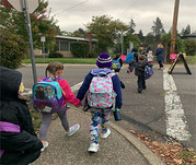 Children walking across crosswalk